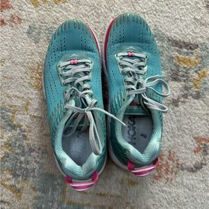 Hoka running/athletic shoes.